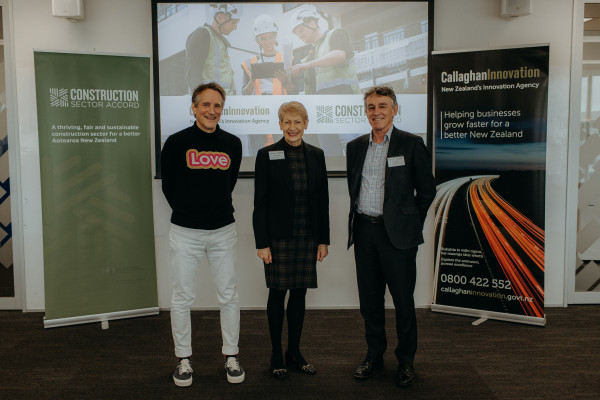 MBIE Chief Executive Carolyn Tremain and Master Builders CE David Kelly celebrate sealing the deal with Callaghan Innovation CE Stefan Korn