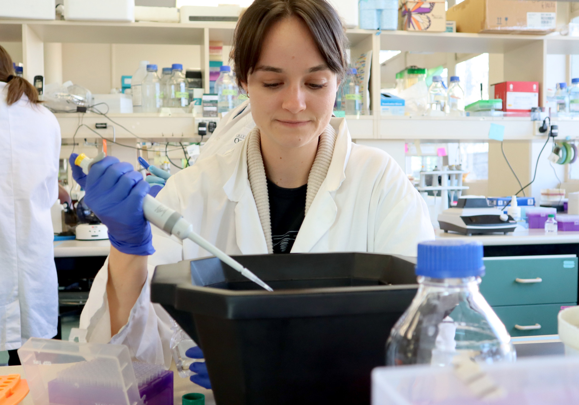 lab worker using a pipette - amaroq