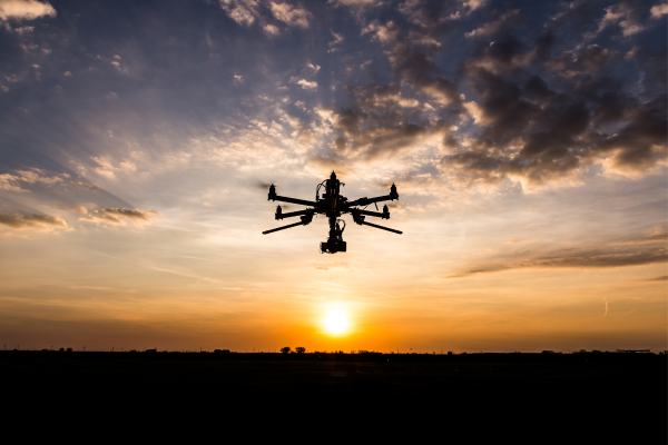 Drone flying into the sunset